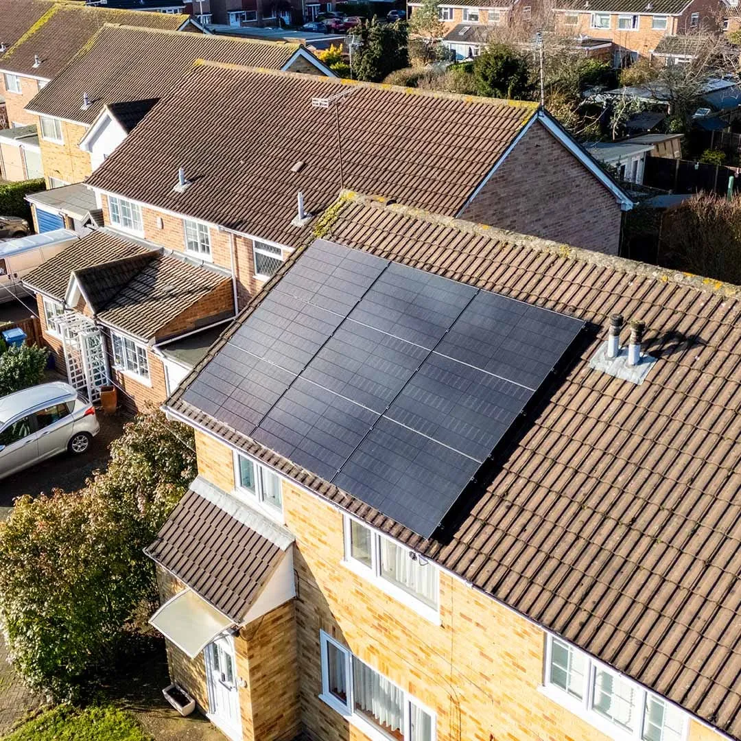 Aerial view of solar panels on UK housing-estate rooftops