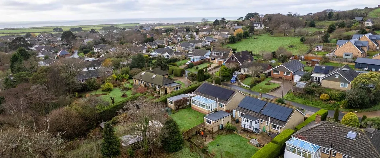 Solar panels on a UK residential roof under a clear sky